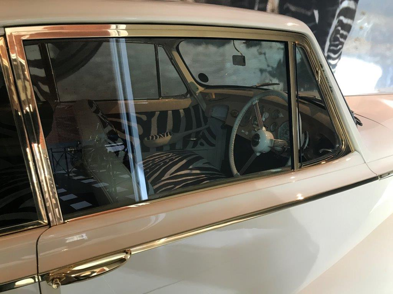 Gold plated trim, zebra skin upholstery, and an ivory dashboard. Classy,